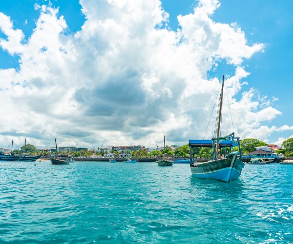 STONE TOWN, ZANZIBAR - DECEMBER 22, 2021: Boats in a port of Stone Town, Zanzibar, Tanzania.
